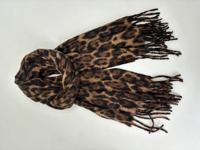 Brown and black leopard print soft scarf with knotted fringe ends, loosely tied, on white background