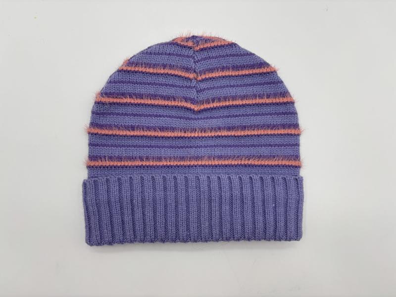 Purple knit beanie hat with coral eyelash yarn stripes and folded ribbed cuff, flat lay on white background
