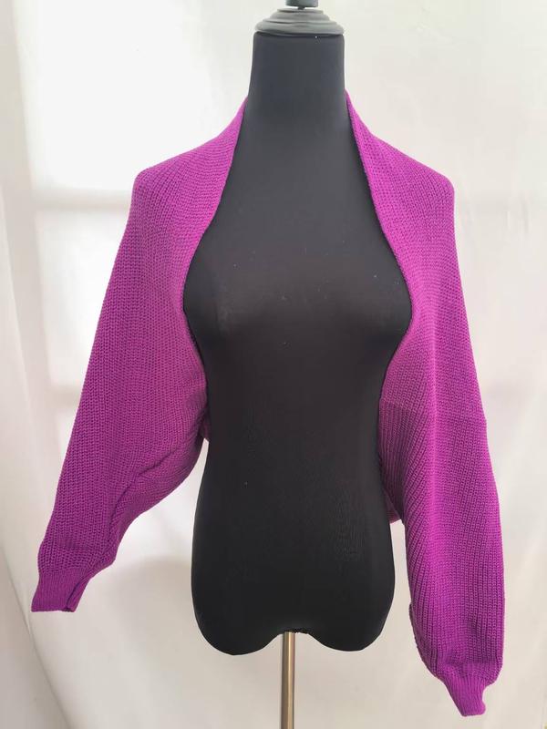 Magenta purple chunky knit open front cropped bolero shrug cardigan with balloon sleeves displayed on black dress form mannequin