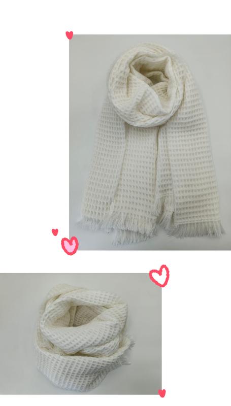 Cream waffle knit scarf with fringe edges, shown draped and looped, ivory textured winter wrap accessory