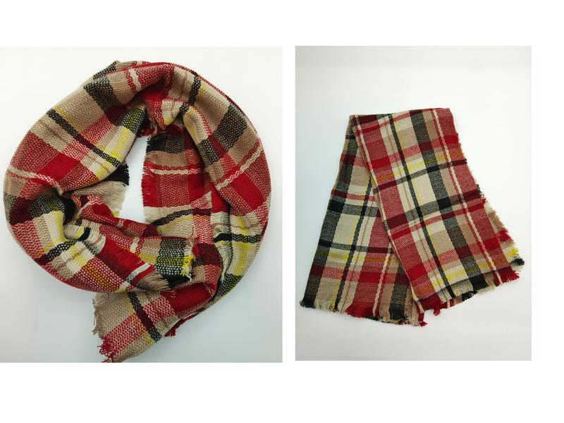 Woven plaid scarf in red, beige, yellow and black with fringe edges, shown looped and folded flat