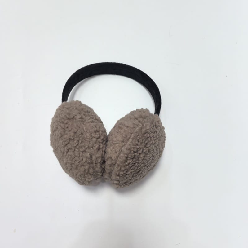 Blush pink plush faux fur winter earmuffs with cute bunny ear accents and headband, laid flat on white background