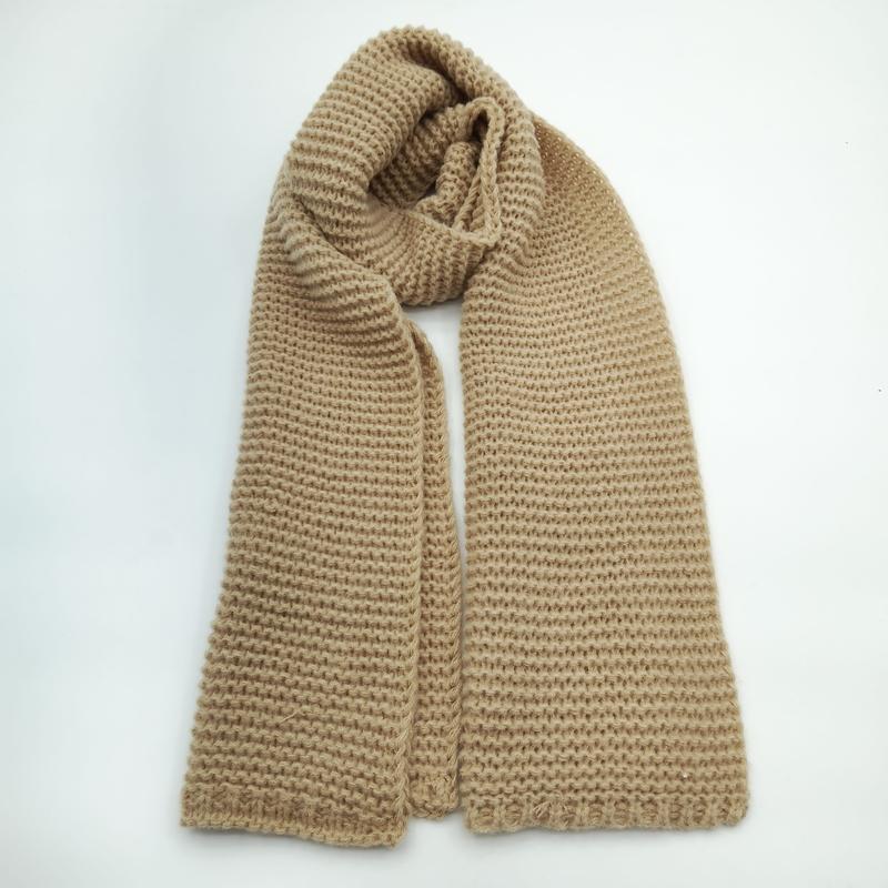 Camel beige chunky knit scarf with waffle texture pattern, loosely looped on white background, soft winter accessory