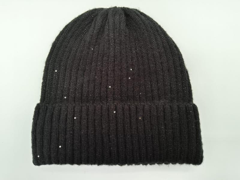 Black chunky ribbed knit beanie hat with scattered sequins and folded cuff, photographed flat on white background