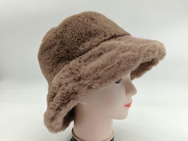 Taupe brown faux fur bucket hat displayed on a mannequin head, side view, soft fluffy plush winter hat
