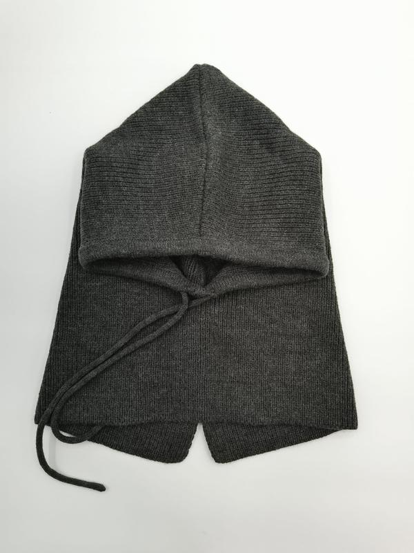 Folded dark gray ribbed knit hooded scarf with drawstring tie, laid flat on white background