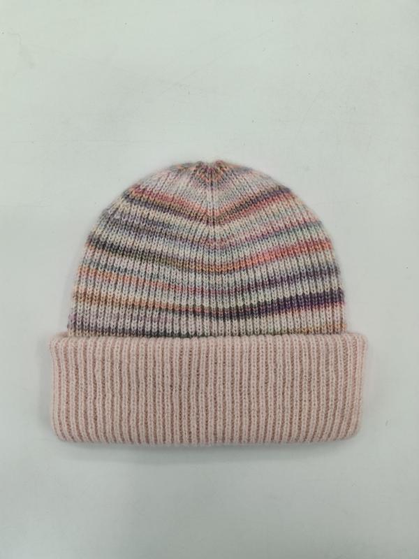 Soft knit beanie hat with multicolor pink purple grey stripes and wide ribbed cuff fold, laid flat on white background