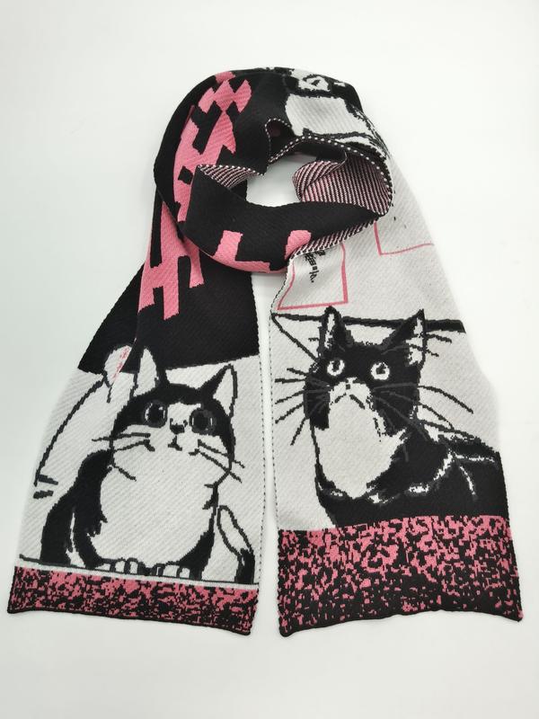 Knitted scarf with black and white tuxedo cat illustrations and pink geometric patterns looped on white background