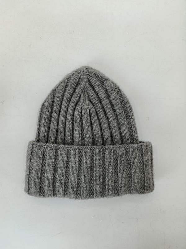 Light grey chunky ribbed knit beanie hat with wide folded cuff, laid flat on white background