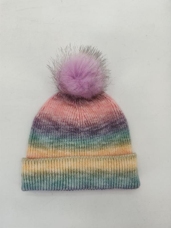 Knitted pastel rainbow ombre beanie hat with lavender faux fur pom pom, featuring pink, purple, teal, and yellow gradient stripes
