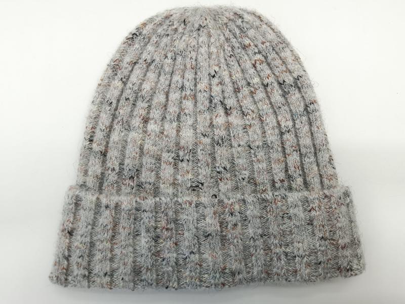 Grey marl ribbed knit beanie hat with multicolor flecked yarn and folded cuff, laid flat on white background