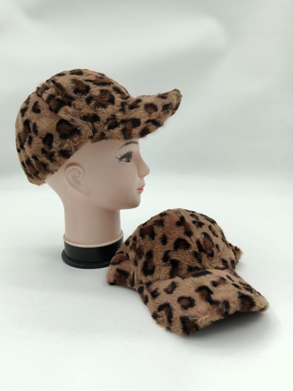 Two faux fur leopard print baseball caps in tan and brown, one displayed on mannequin head and one laid flat