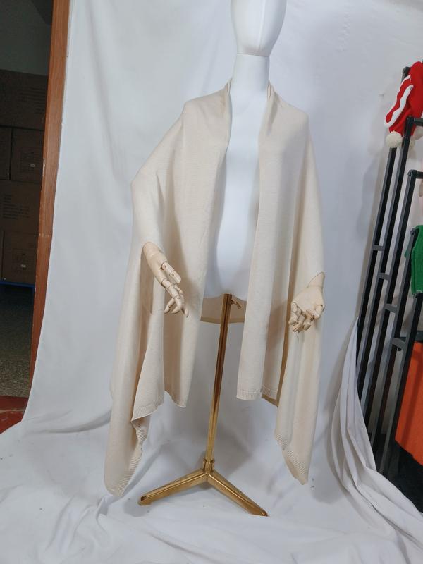 Cream ivory fine knit open-front wrap shawl poncho draped on mannequin with ribbed hem trim