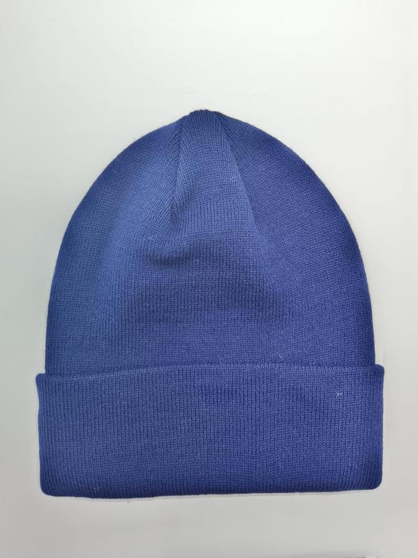 Plain royal blue knit beanie hat with folded ribbed cuff, laid flat on white background, unisex winter cap