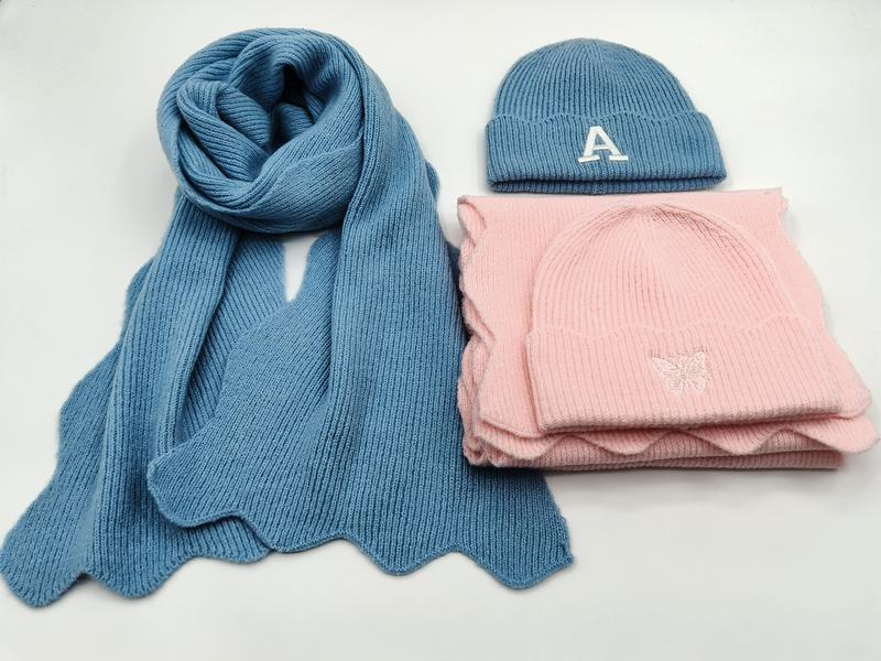 Blue ribbed knit scarf with letter A embroidered beanie and pink butterfly embroidered beanie hat with matching pink scarf set