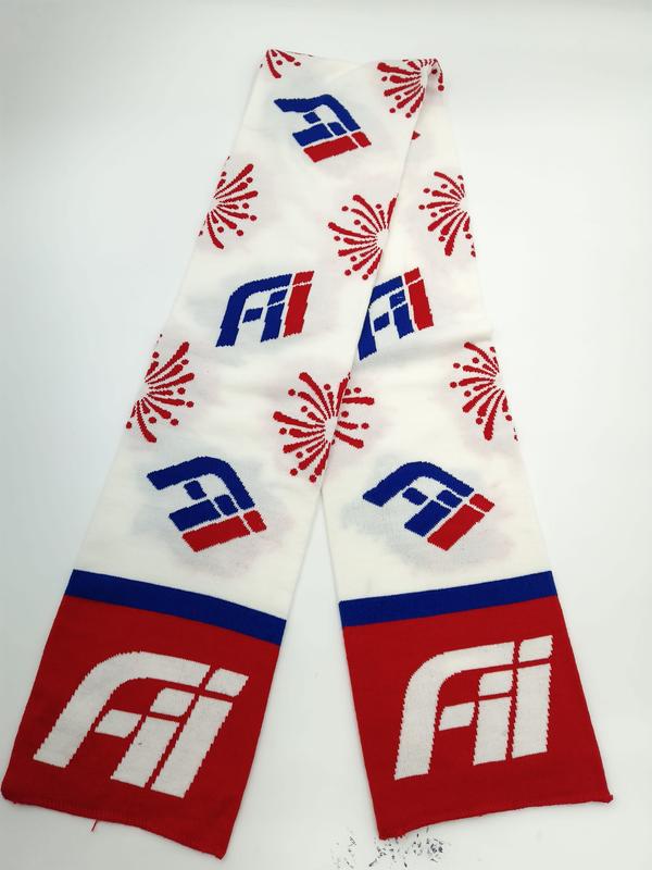 Knitted scarf in red, white and blue with repeated logo and firework motifs, red ends with large white emblem