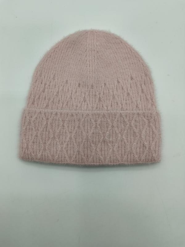 Blush pink fluffy cable knit beanie hat with diamond pattern and folded cuff on light background
